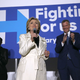 New York City Mayor Bill de Blasio (right) and his wife Chirlane McCray (left) look on as Democratic presidential candidate Hillary Clinton speaks at a debate watch party on April 14, 2016, in New York City. (Justin Sullivan/Getty Images)